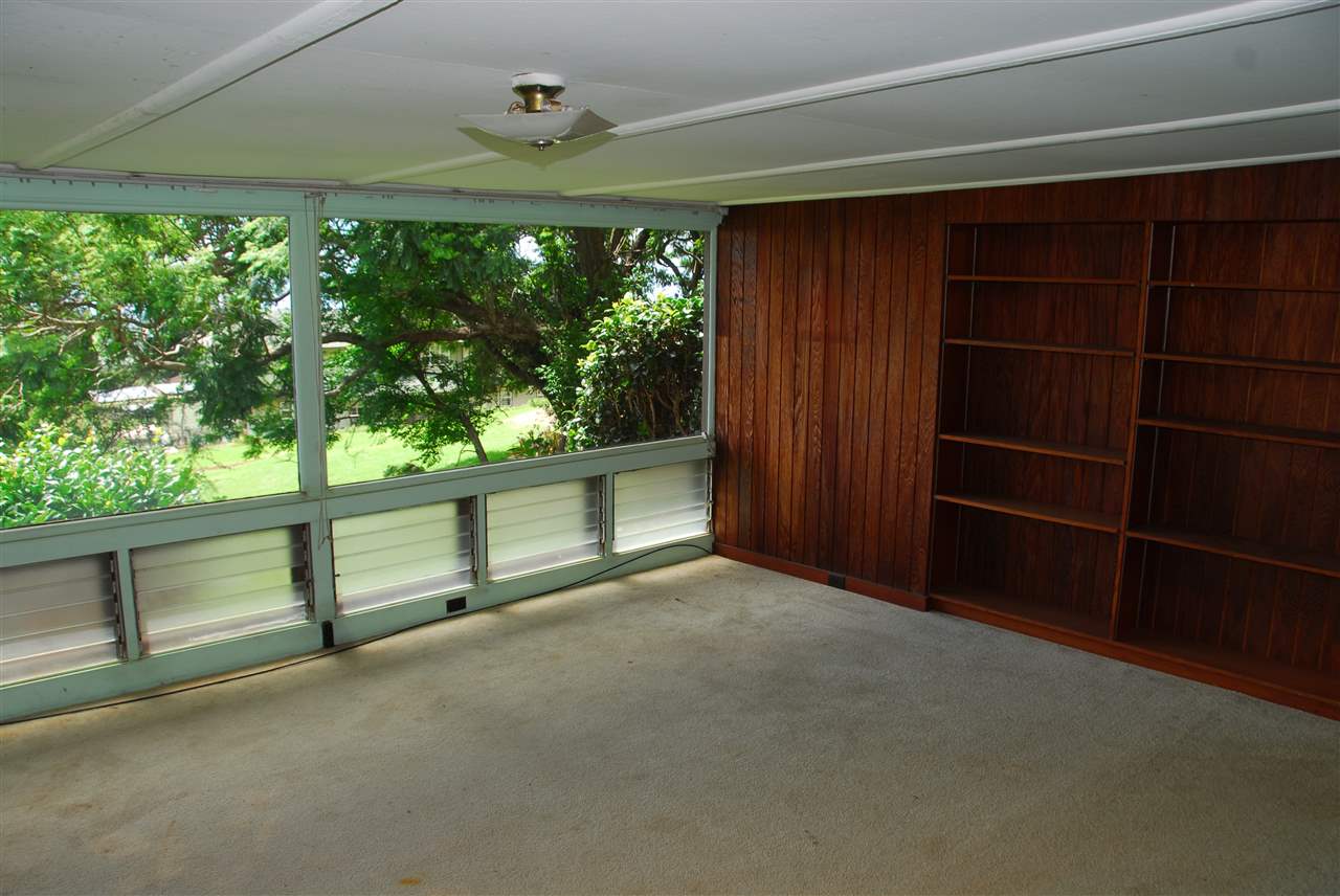 745 Lower Kimo Drive, Unit A Kula, HI 96790 - Photo 13 of 16 a view of an empty room with a window and a ceiling fan