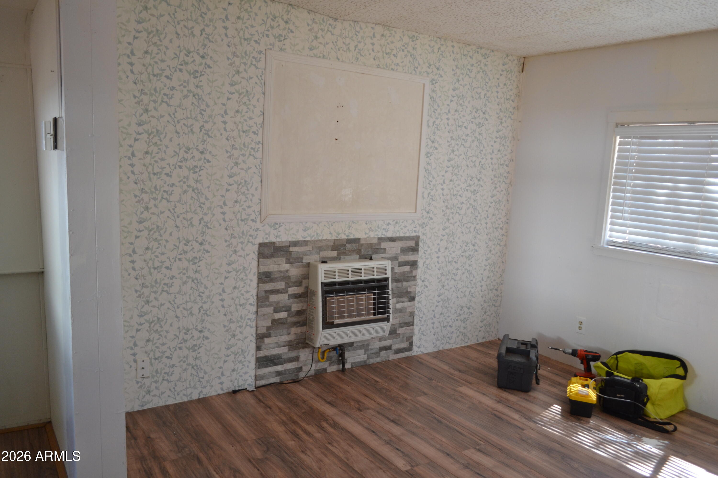 5994 D Street Lakeside, AZ 85929 - Photo 7 of 21 a bedroom with a bed and a fireplace