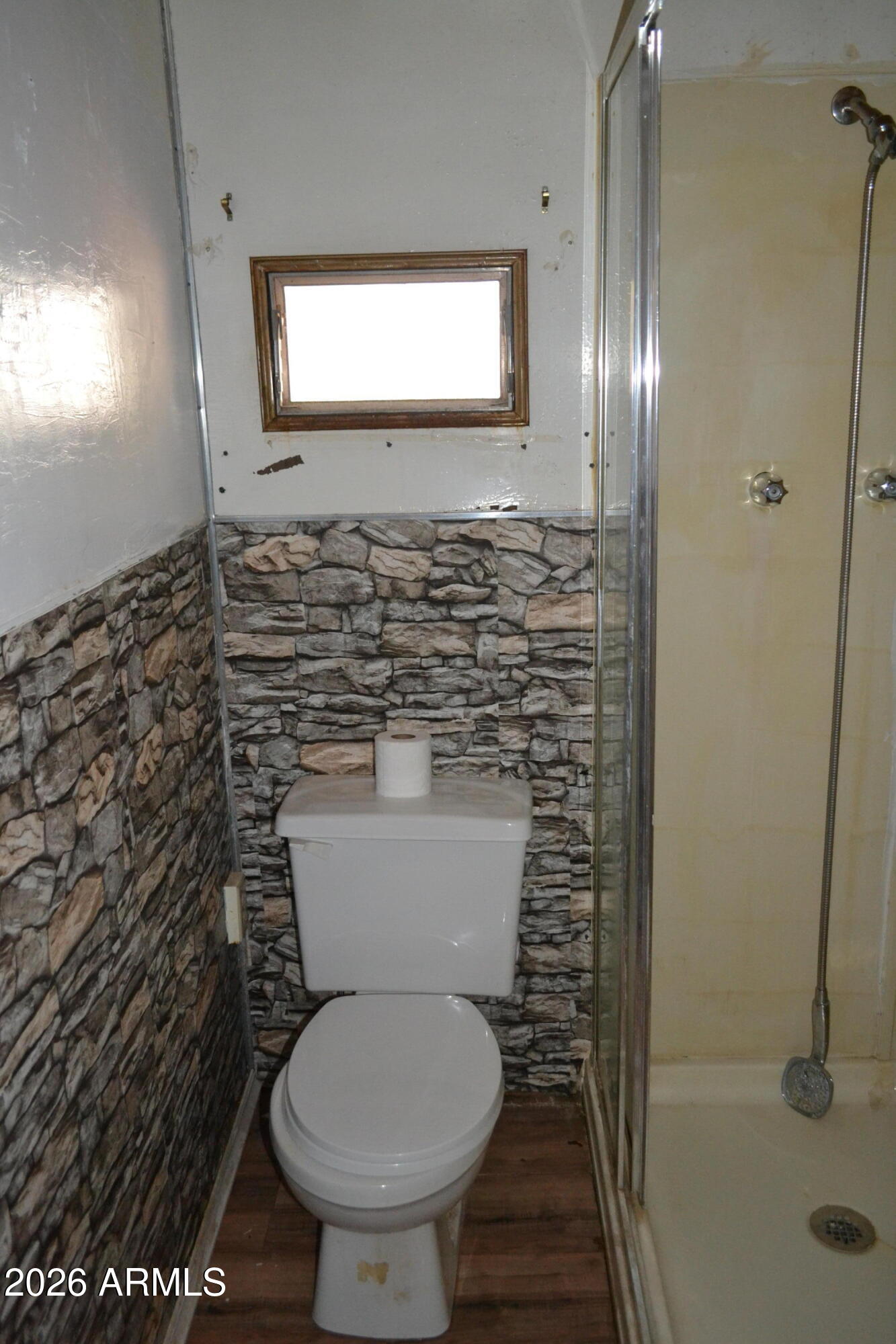 5994 D Street Lakeside, AZ 85929 - Photo 10 of 21 a bathroom with a toilet and a shower