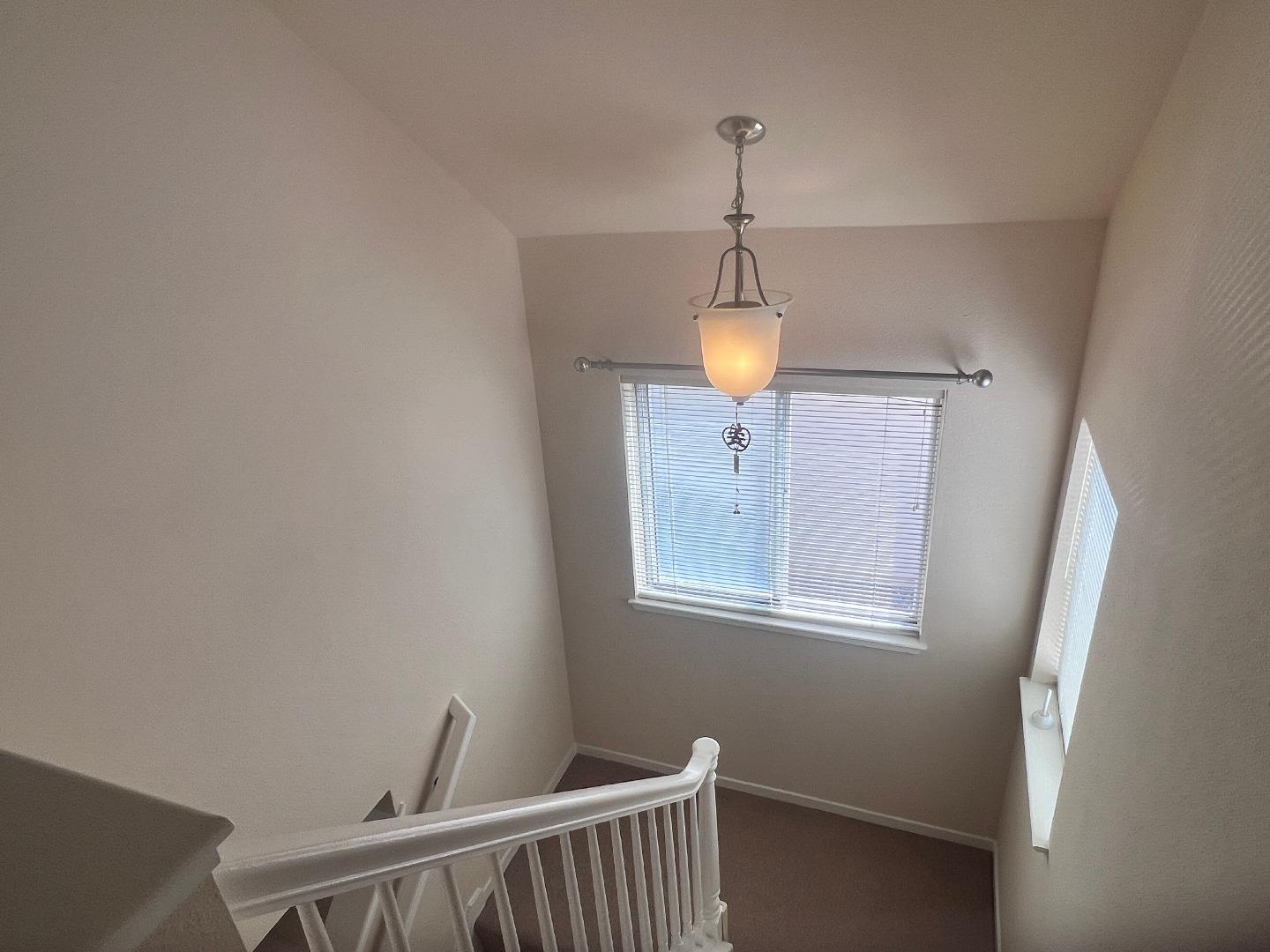 110 Whits Road Mountain View, CA 94040 - Photo 13 of 33 a view of hallway with window and wooden floor