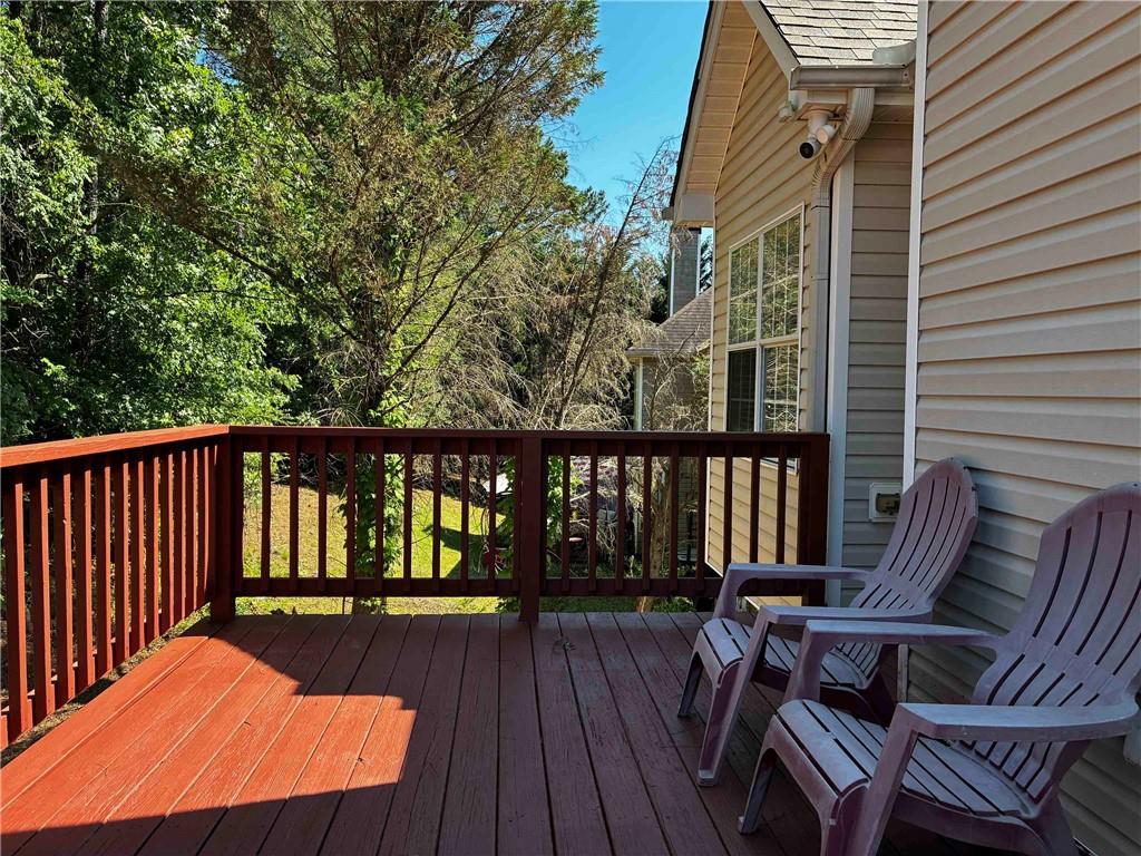 337 Madison Avenue Hampton, GA 30228 - Photo 32 of 32 a view of balcony with wooden floor and outdoor seating