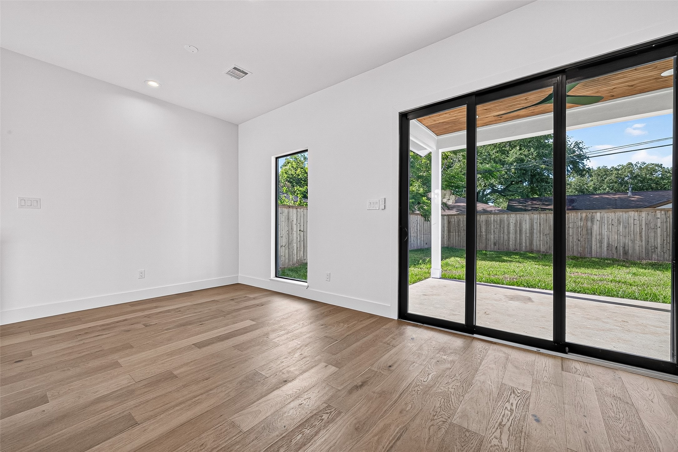 4802 Hummingbird Street Houston, TX 77035 - Photo 17 of 43 Large sliding doors that lead out to back patio
