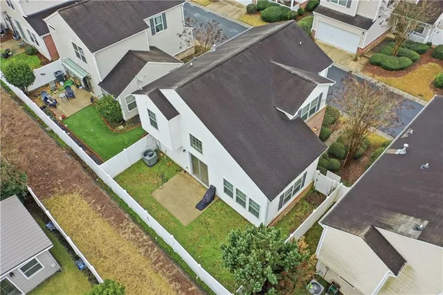 an aerial view of a house with a garden