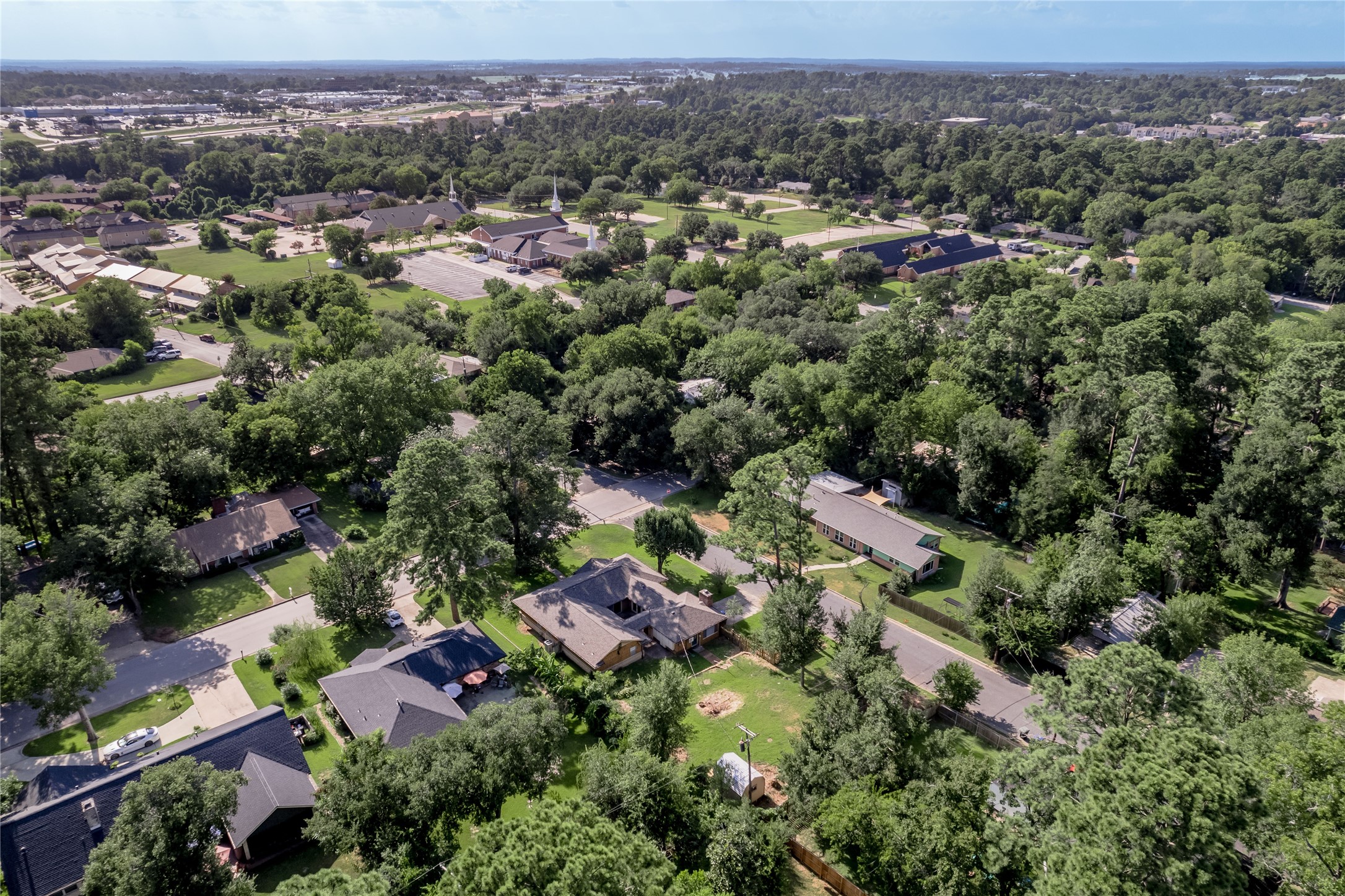 2001 Ave Q Huntsville, TX 77340 - Photo 18 of 18 an aerial view of a houses with a lush green hillside