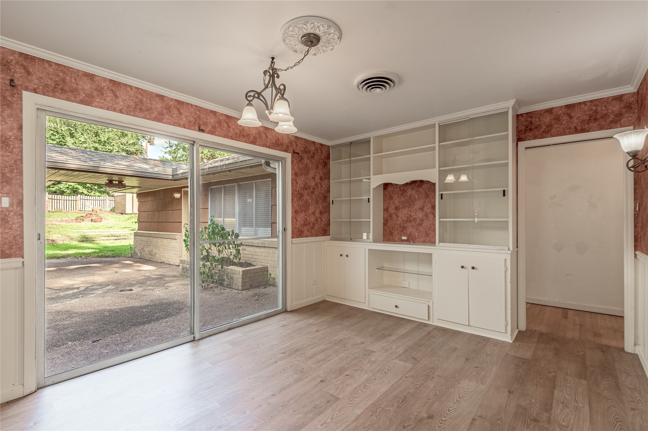 2001 Ave Q Huntsville, TX 77340 - Photo 4 of 18 a view of a room with window and cabinet