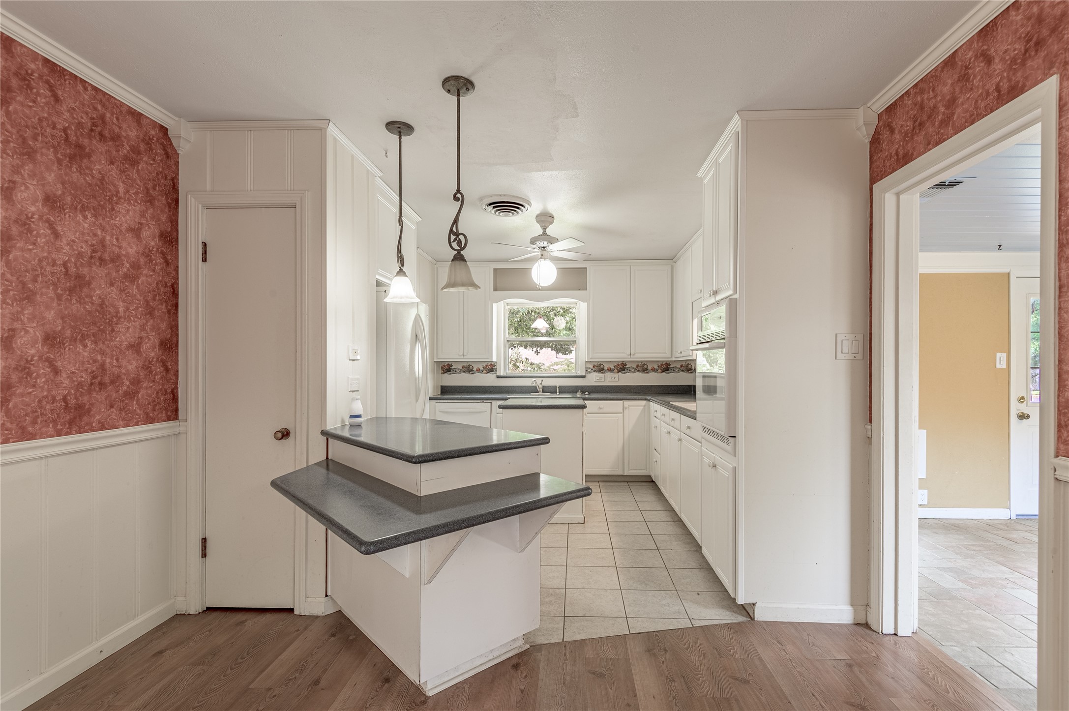 2001 Ave Q Huntsville, TX 77340 - Photo 5 of 18 a view of kitchen with counter top space and refrigerator
