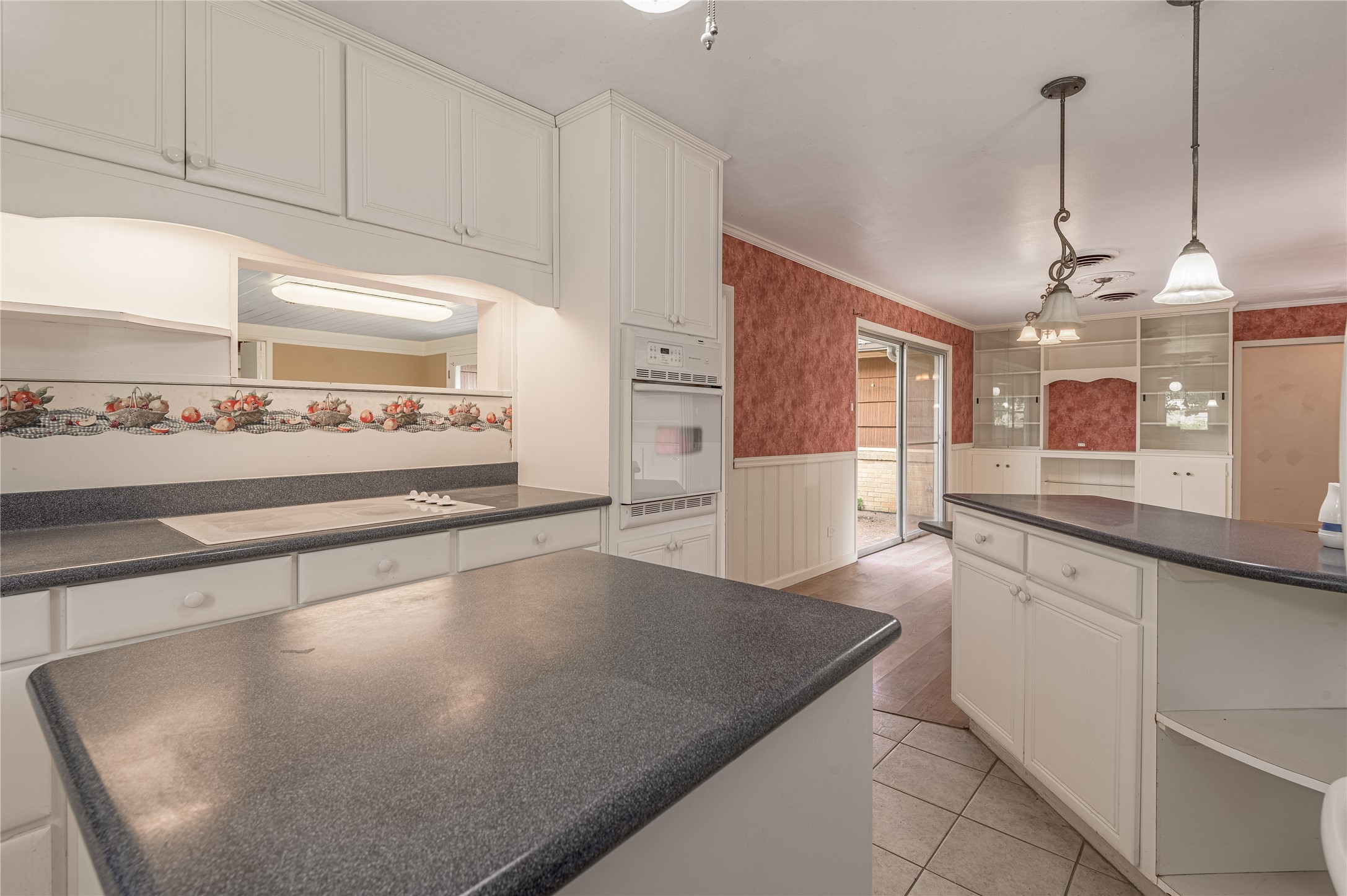 2001 Ave Q Huntsville, TX 77340 - Photo 6 of 18 a large kitchen with kitchen island a counter space a sink and appliances