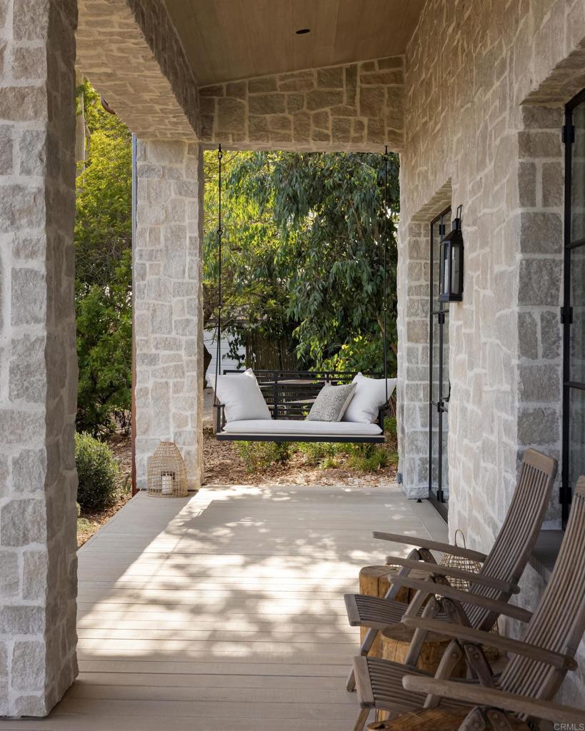 17845 Via De Fortuna Rancho Santa Fe, CA 92067 - Photo 39 of 45 a view of a patio with table and chairs and potted plants