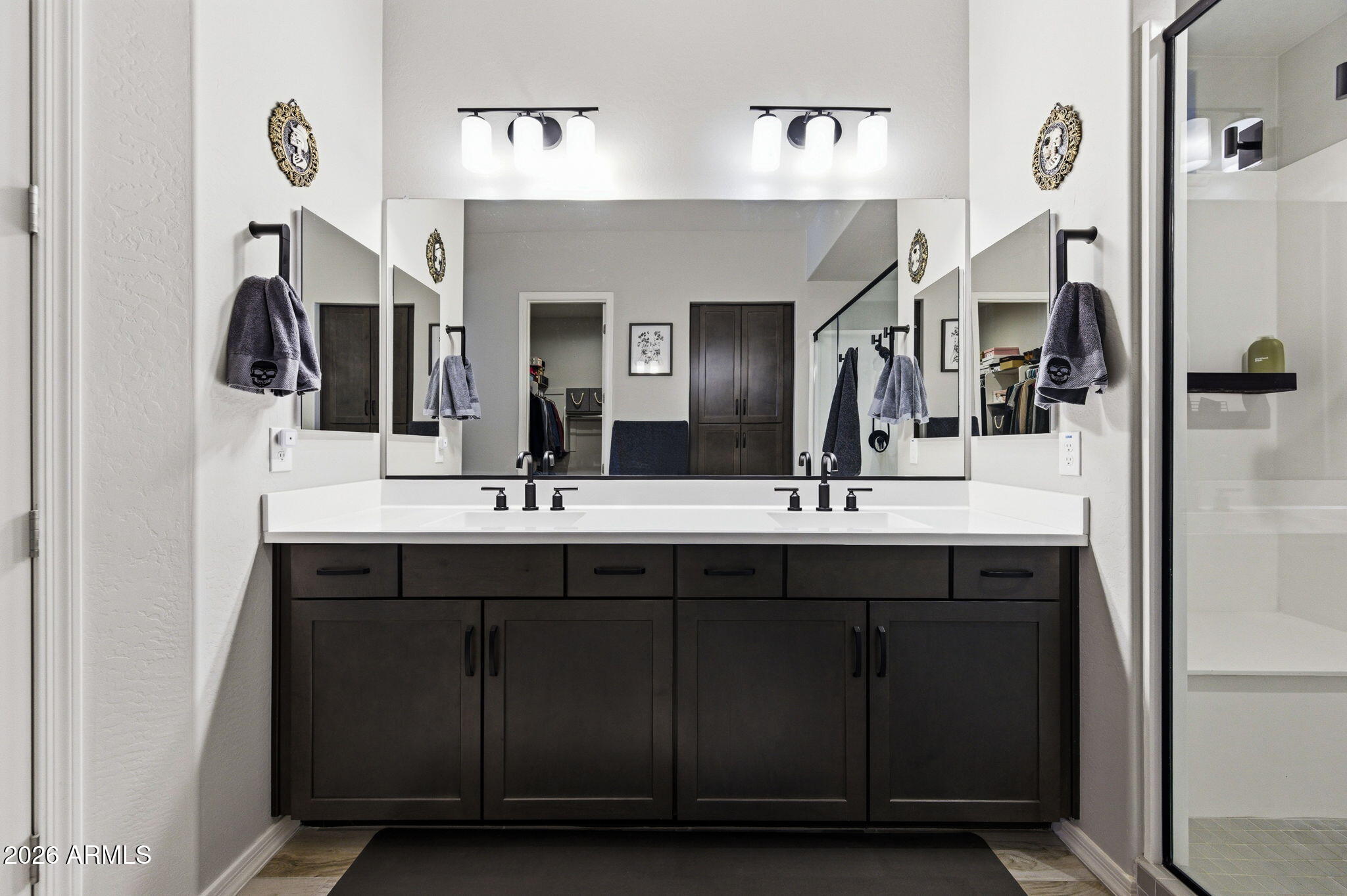 23066 East Mayberry Road Queen Creek, AZ 85142 - Photo 15 of 39 a bathroom with double vanity sinks and a mirror