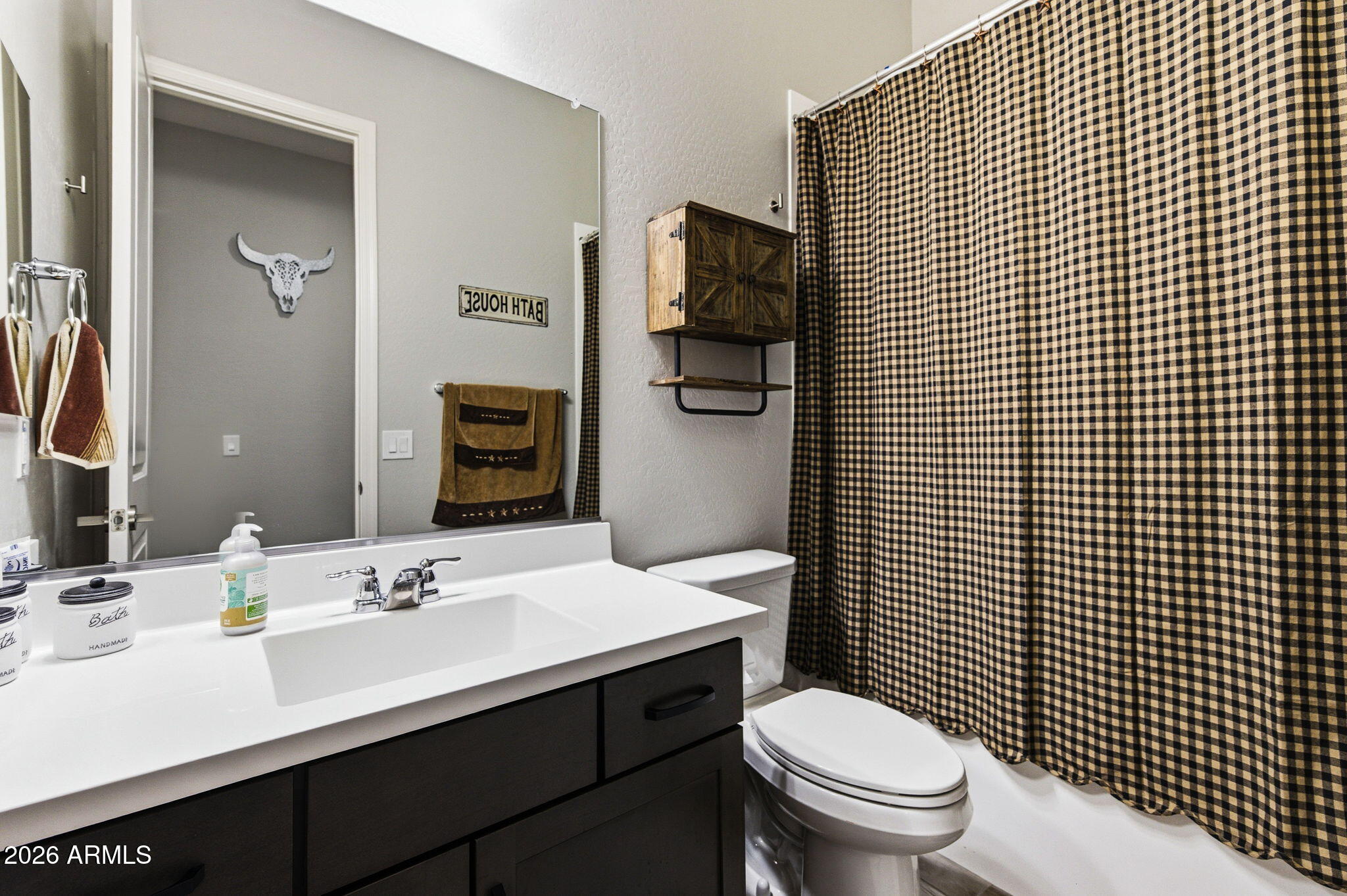 23066 East Mayberry Road Queen Creek, AZ 85142 - Photo 17 of 39 a bathroom with a sink a toilet and mirror