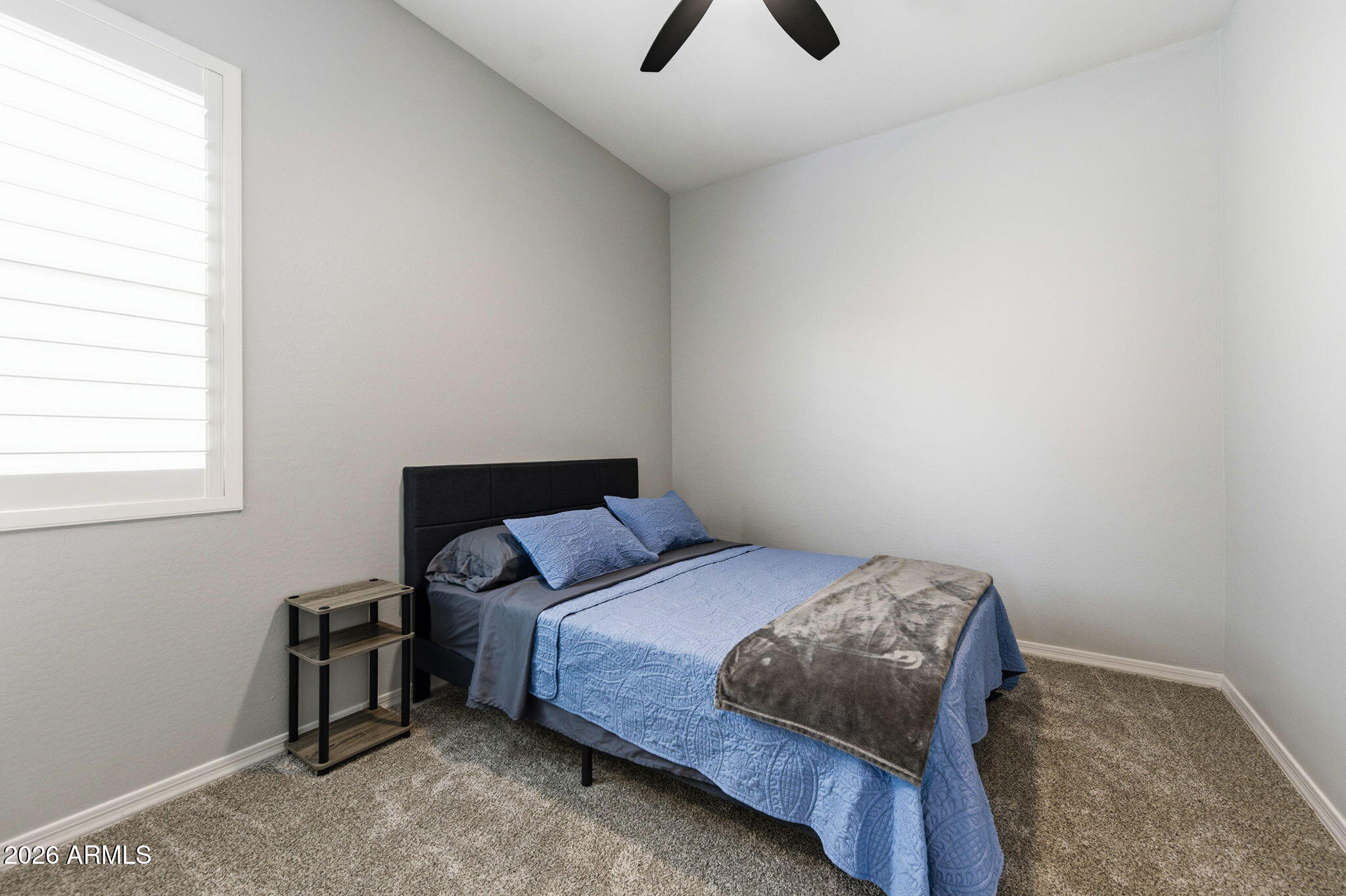 23066 East Mayberry Road Queen Creek, AZ 85142 - Photo 19 of 39 a bedroom with a bed and a window