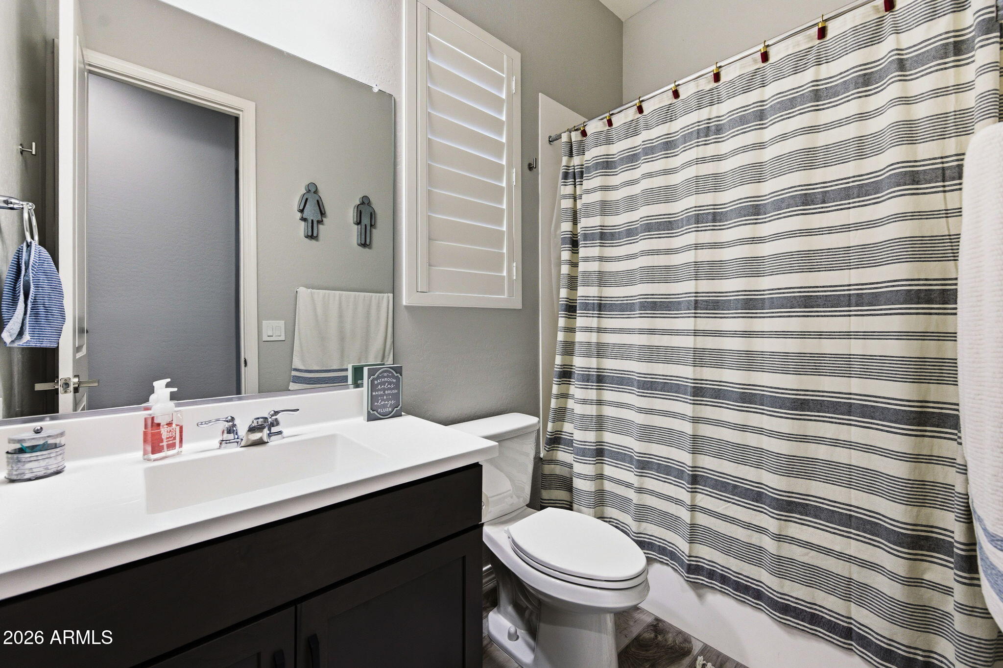 23066 East Mayberry Road Queen Creek, AZ 85142 - Photo 20 of 39 a bathroom with a sink toilet and shower
