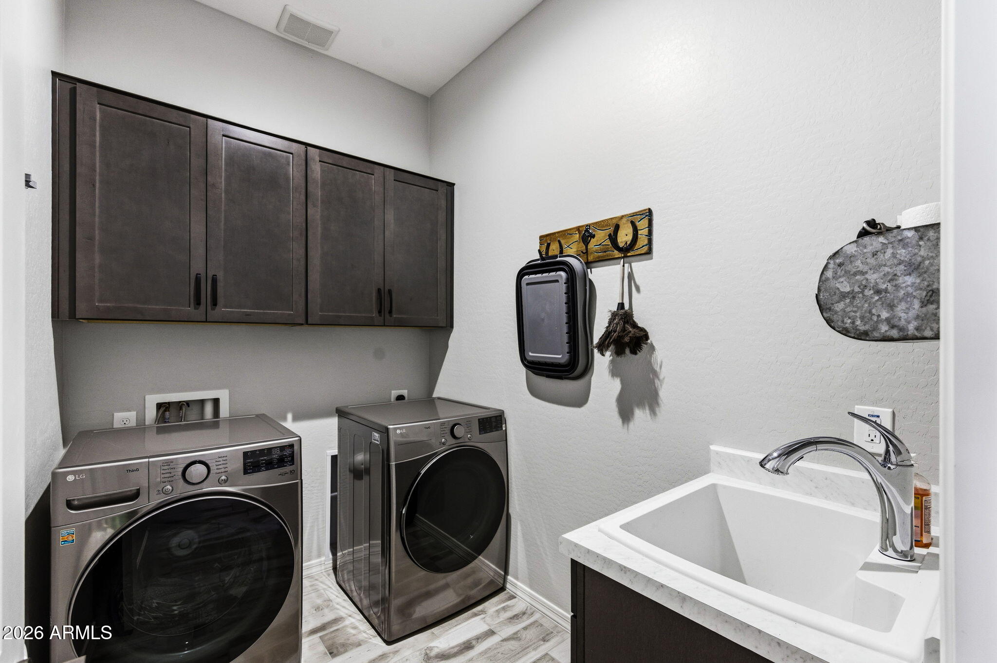 23066 East Mayberry Road Queen Creek, AZ 85142 - Photo 22 of 39 a utility room with sink dryer and washer