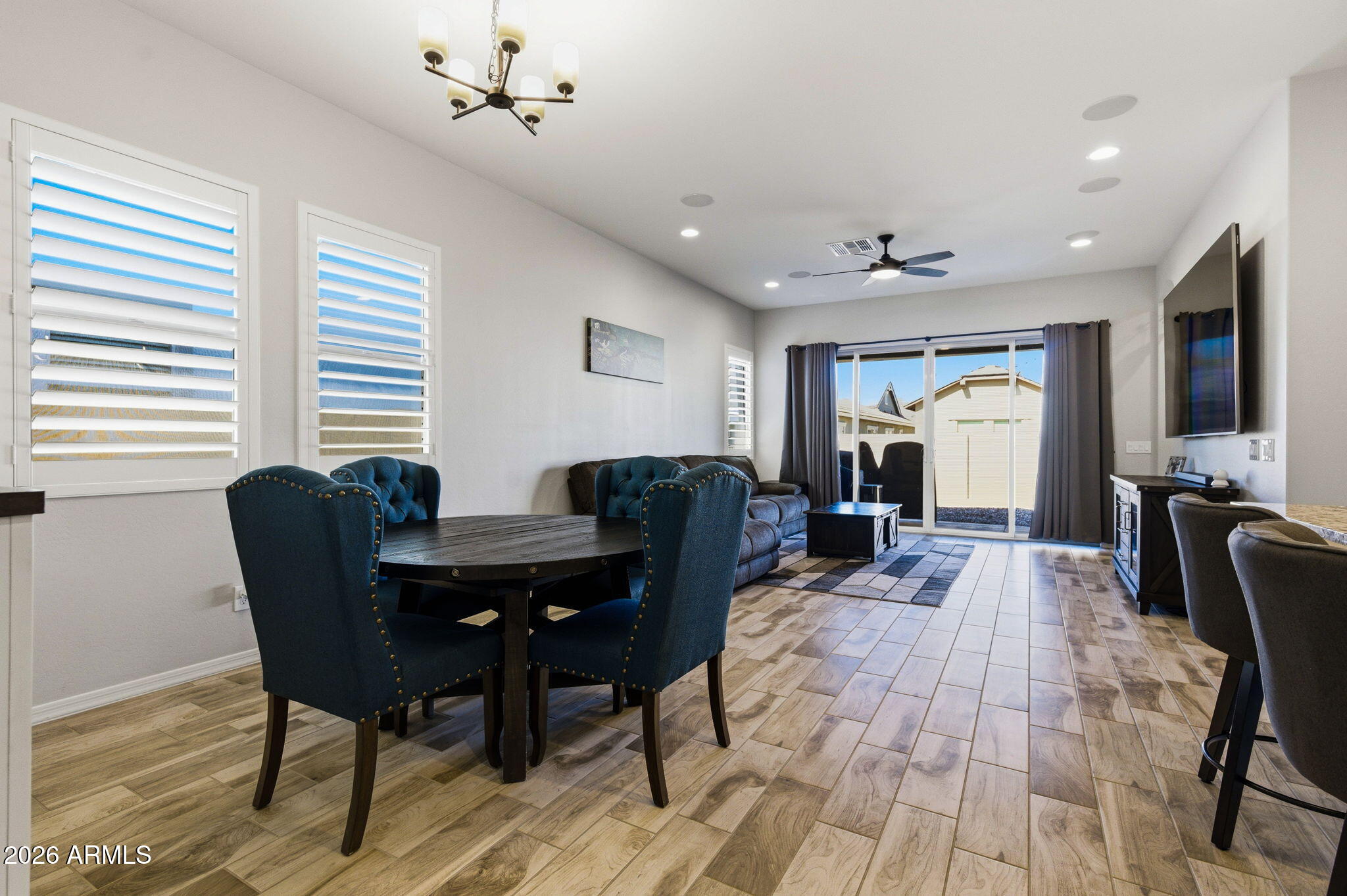 23066 East Mayberry Road Queen Creek, AZ 85142 - Photo 8 of 39 a view of a dining room with furniture window and wooden floor