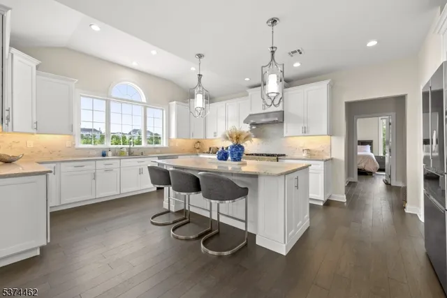 a kitchen with a sink cabinets and window