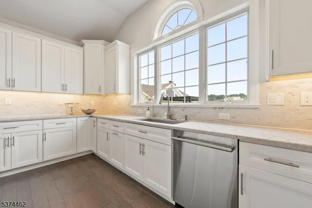 a kitchen with sink cabinets and window
