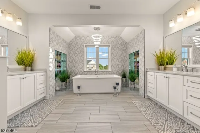 a spacious bathroom with a tub sink and mirror