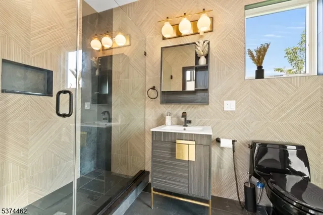 a bathroom with a sink a mirror and a shower