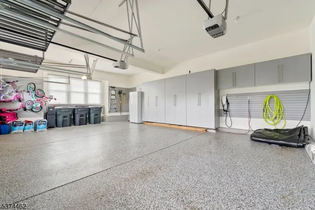 a hallway with toys and a chandelier