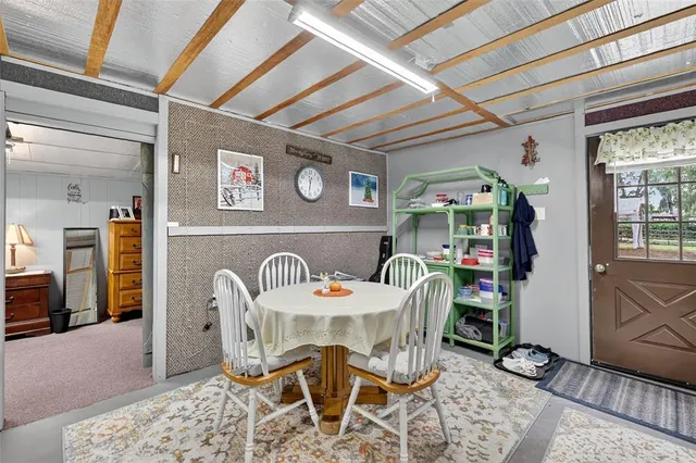 a bed room with furniture and a flat screen tv