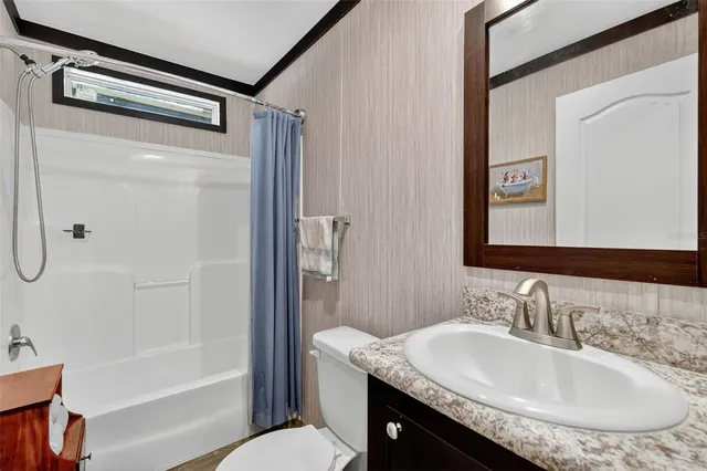 a bathroom with a shower and a bath tub