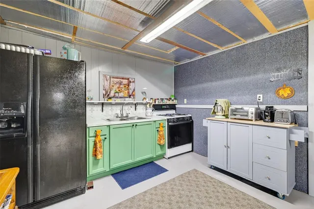 a living room with furniture a fireplace and a large window