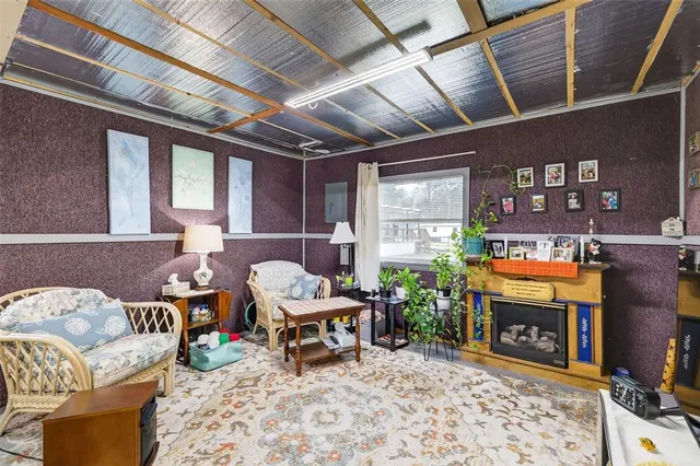 a kitchen with a stove top oven and refrigerator