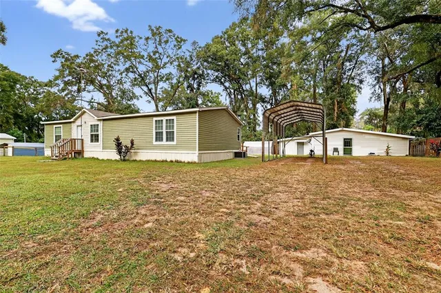 a house with trees in the background