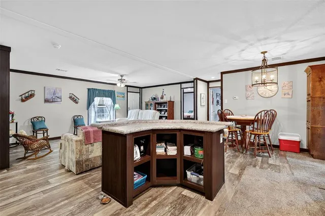 a bedroom with furniture and a flat screen tv