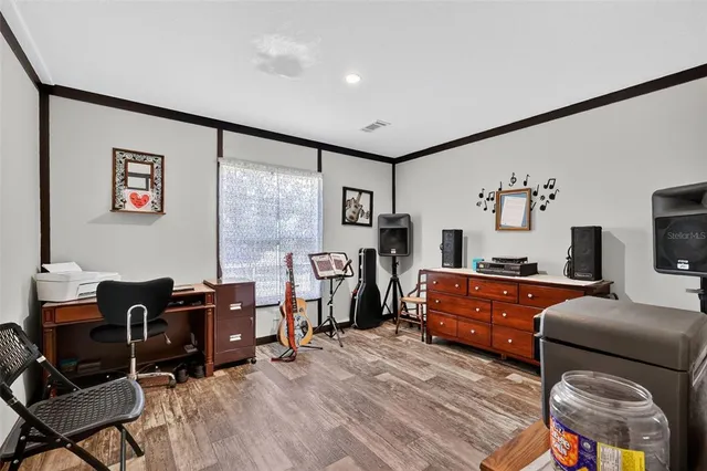 a bedroom with a bed and a table in it