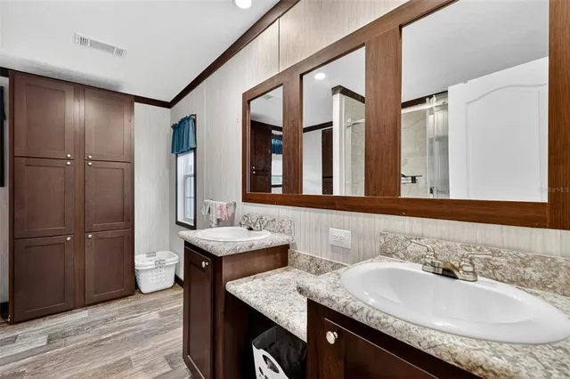a view of a house with pool porch and sitting area