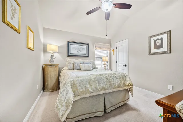 a bedroom with a bed and dresser