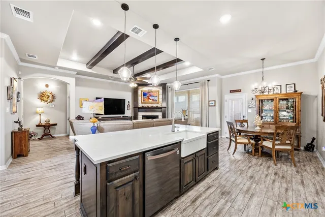 a large kitchen with a table and chairs