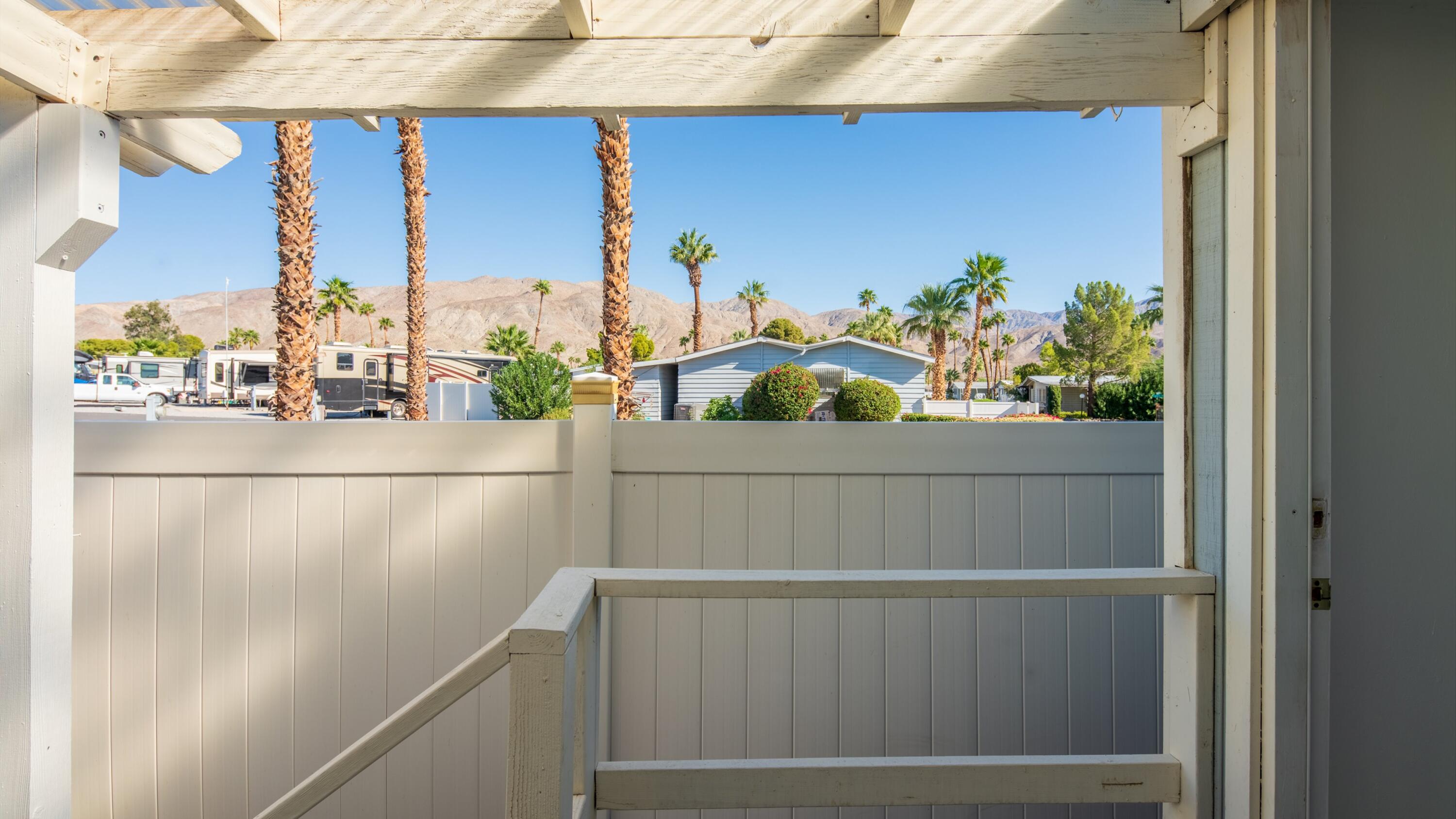 74711 Dillon Road, Unit 392 Desert Hot Springs, CA 92241 - Photo 28 of 46 a view of a balcony and car parked