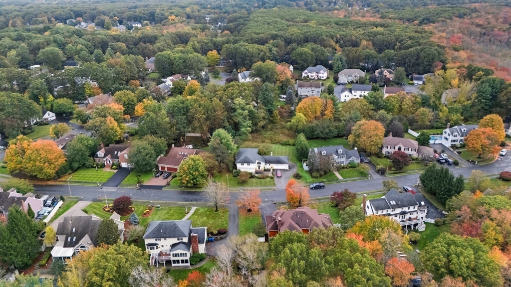 98 Lilah Lane Reading, MA 01867 - Photo 32 of 37 an aerial view of a houses with yard
