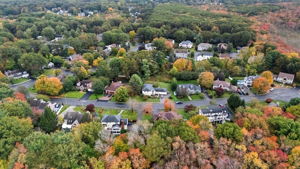 98 Lilah Lane Reading, MA 01867 - Photo 33 of 37 an aerial view of residential houses with outdoor space and trees