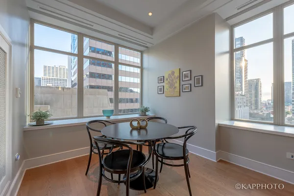 a dining room with furniture and window