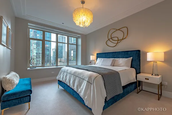 a bedroom with bed and window