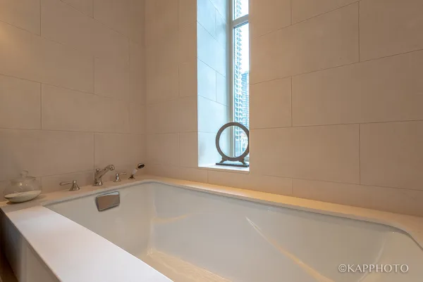 a bathroom with a bathtub and a sink