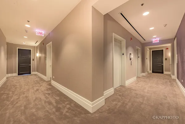 a view of entryway with kitchen