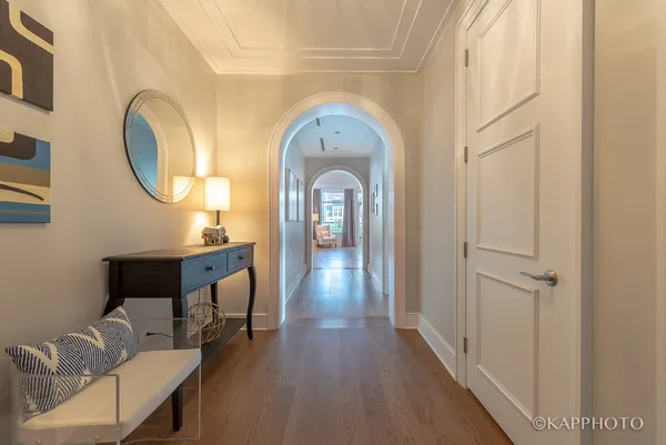 a view of a hallway with seating area