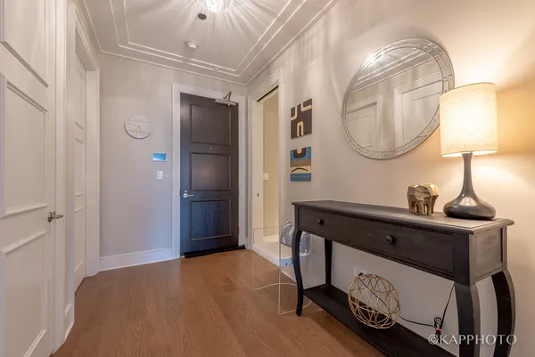 a bedroom with a bed and a mirror