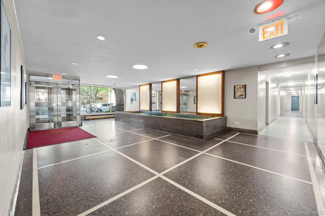 a room with lots of tables and large windows