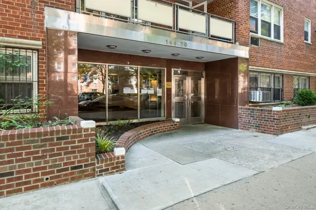 a view of a brick building with a large window