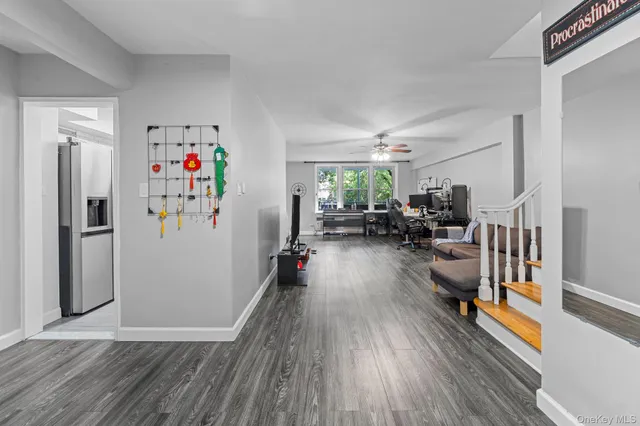 a view of a livingroom with furniture hardwood floor and a view of living room