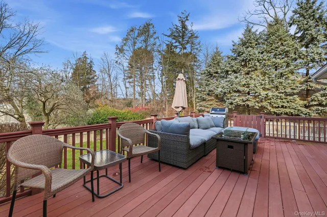 a terrace of a house with outdoor seating