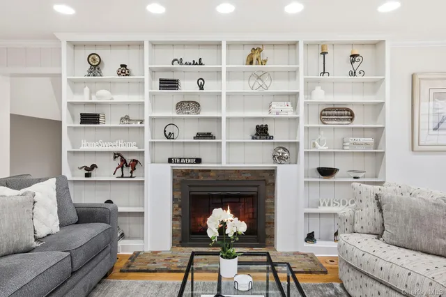 a living room with furniture and a fireplace