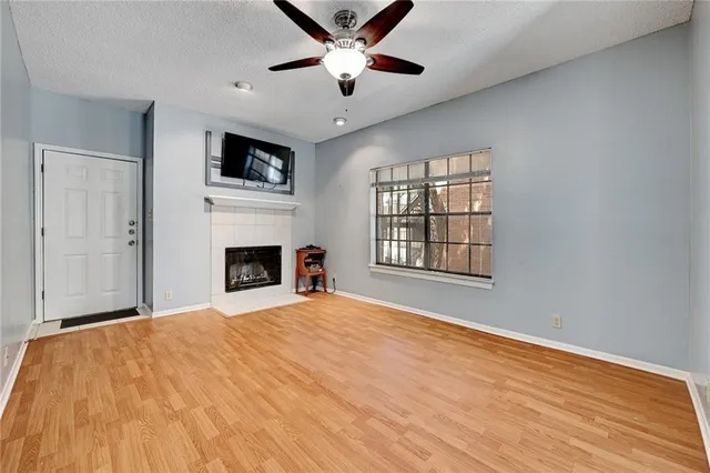 a bedroom with a bed and a fireplace