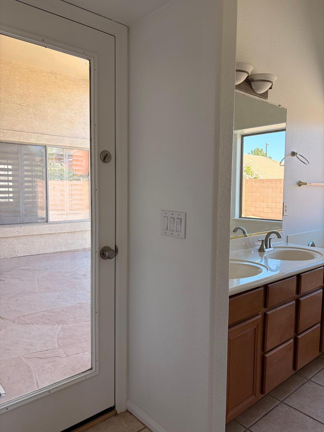 3872 East Simpson Road Gilbert, AZ 85297 - Photo 13 of 25 a bathroom with a sink a mirror and window