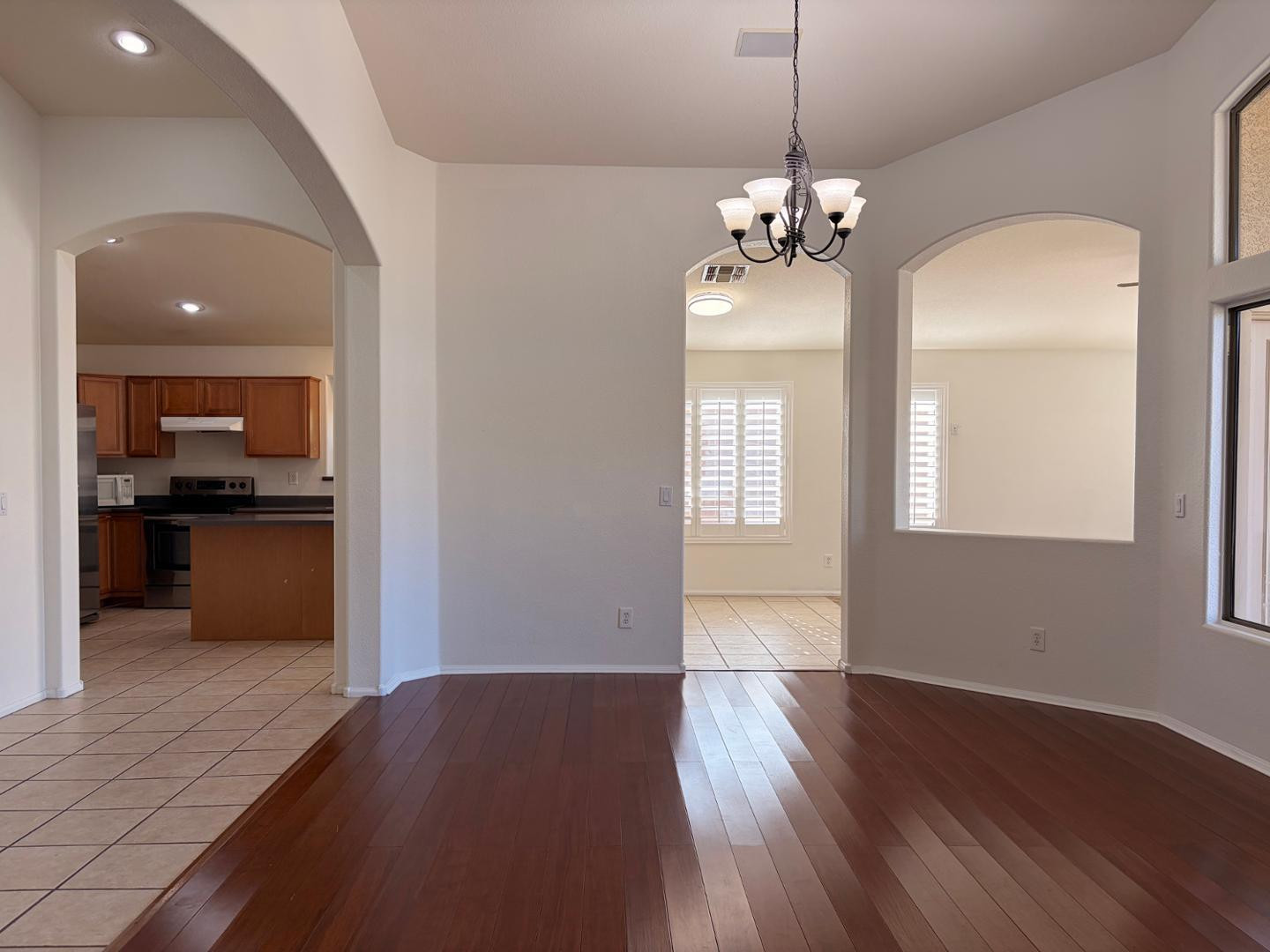 3872 East Simpson Road Gilbert, AZ 85297 - Photo 17 of 25 a view of a kitchen with wooden floor and a kitchen